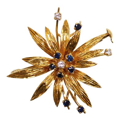 Lot 129 - An 18ct gold sapphire and diamond floral...