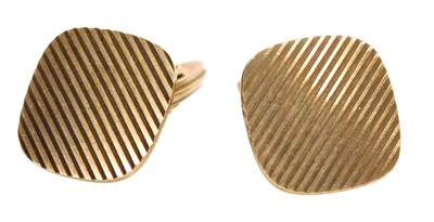 Lot 147 - A pair of 9ct gold cufflinks, with engine...