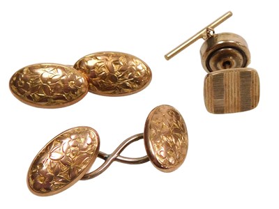 Lot 235 - A pair of 9ct two colour gold oval and scroll...