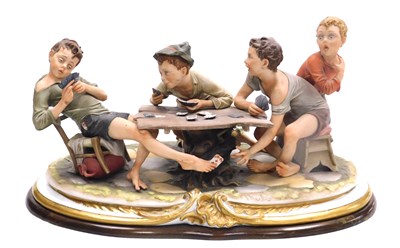 Lot 31 - A Capodimonte porcelain figure group, modelled...