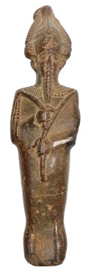 Lot 60 - An Egyptian clay figure of a God Osiris,...