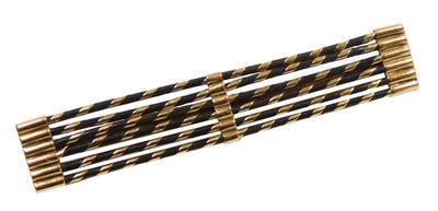 Lot 241 - An ebony bar brooch, of six rod form, bound in...
