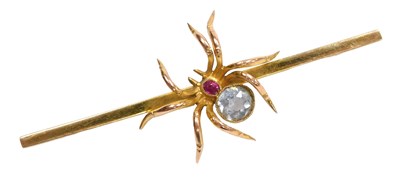 Lot 245 - A ruby and aquamarine bar brooch, formed as a...