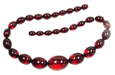 Lot 247 - A partial string of graduated cherry amber...