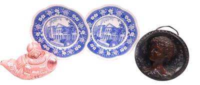 Lot 70 - A late 19thC continental pottery wall plaque,...