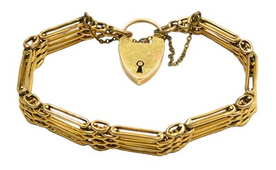 Lot 198 - A four bar gate bracelet, on a heart shaped...