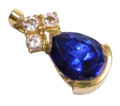 Lot 558 - A tanzanite and diamond pendant, the pear...