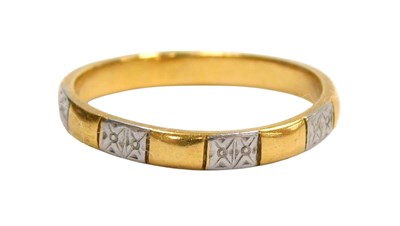 Lot 567 - A 22ct gold and platinum wedding band, of...