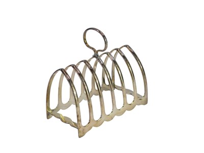 Lot 52 - A George V silver six division toast rack, of...