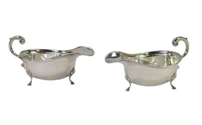 Lot 53 - A pair of George V silver sauce boats, each...