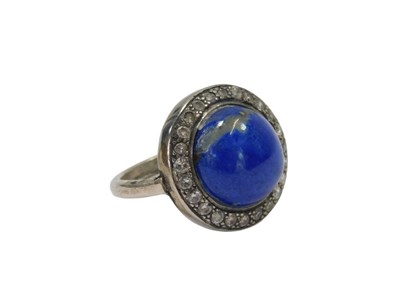 Lot 92 - An Art Deco lapis lazuli and diamond ring, the...