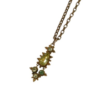 Lot 85 - An Eastern influence stone set pendant, each...