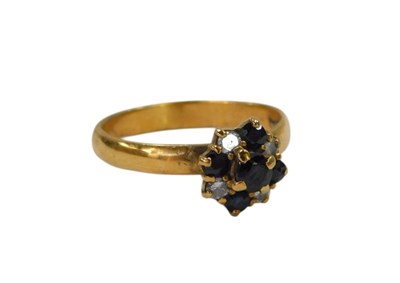 Lot 81 - A sapphire and diamond floral cluster ring,...