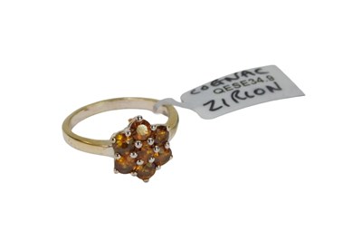 Lot 103 - An Indian cognac zircon floral cluster...
