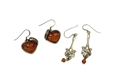 Lot 102 - A pair of silver gilt amber drop earrings, of...