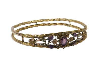 Lot 59 - A Victorian amethyst and seed pearl bangle,...