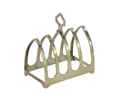 Lot 57 - A George V silver four division toast rack, of...