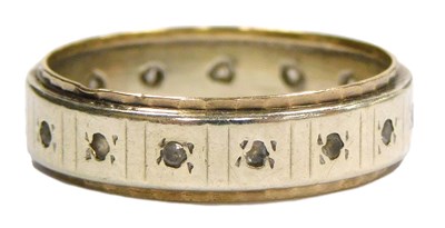 Lot 348 - A CZ and bi-colour full eternity band, stamped...