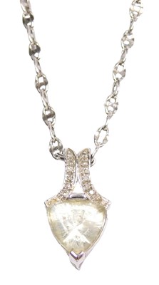 Lot 354 - A 9ct white gold and white topaz pendant, the...