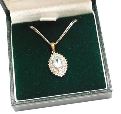 Lot 362 - An aquamarine and diamond pendant, the oval...