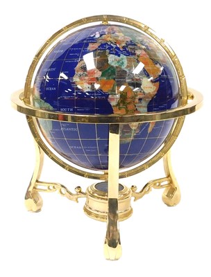 Lot 97 - A terrestrial hardstone globe, in a brass...