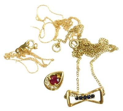 Lot 361 - A ruby and diamond pendant, in a teardrop...