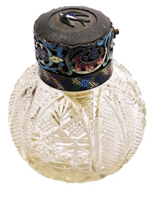 Lot 258 - An early 20thC cut glass and champleve enamel...