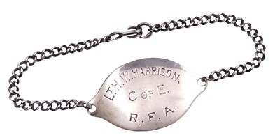 Lot 263 - A World War I silver dog tag, named to Lt. H.W....