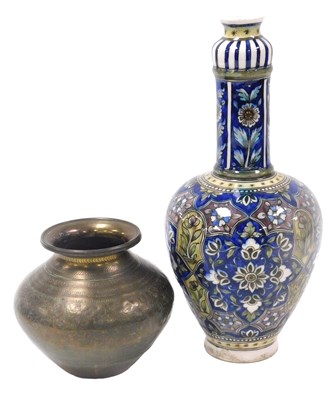 Lot 294 - An Iznik pottery vase, of long-necked bulbous...
