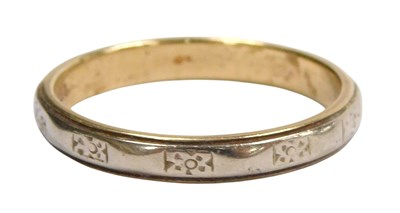 Lot 589 - A 9ct two colour gold wedding band, with...