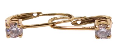 Lot 593 - A pair of CZ solitaire earrings, with fishhook...