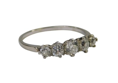 Lot 111 - A five stone diamond ring, each graduated...