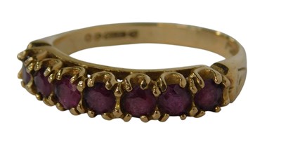 Lot 122 - A 9ct gold and garnet seven stone ring, claw...