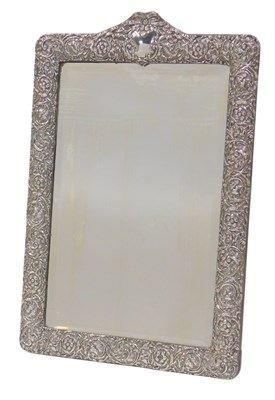 Lot 41 - An Edward VII silver framed mirror, the top...