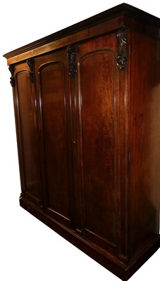 Lot 450 - An early Victorian mahogany triple wardrobe,...
