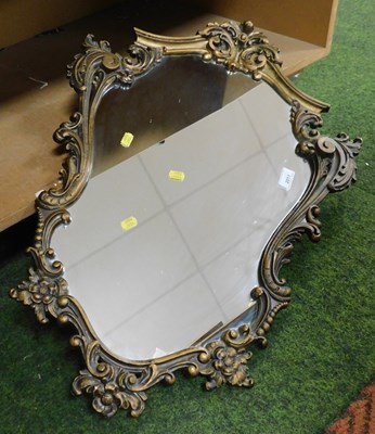 Lot 2011 - A wall mirror, in a scrolling frame, 70cm x 54cm.