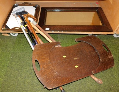 Lot 2034 - An oak framed wall mirror, together with...