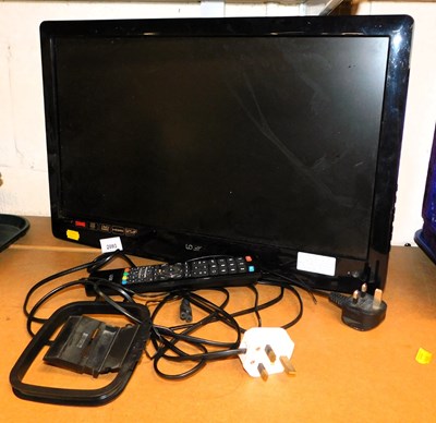 Lot 2093 - A Logik 21" wall mounted television, with lead...