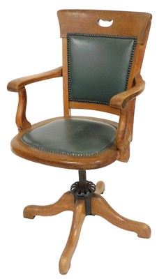 Lot 716 - An early 20thC oak office chair, with a green...