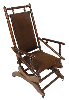 Lot 722 - A 19thC American walnut rocking chair, with a...