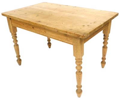 Lot 725 - A pine kitchen table, the rectangular top on...