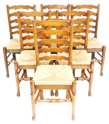 Lot 750 - A set of six oak ladder back dining...