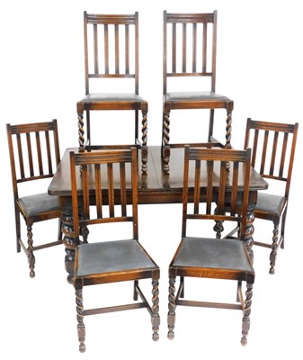Lot 761 - An early 20thC oak extending dining table, the...