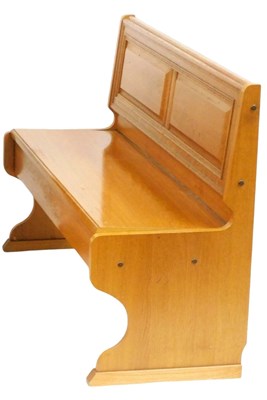 Lot 777 - A light oak pew, with a panelled back, 140cm...