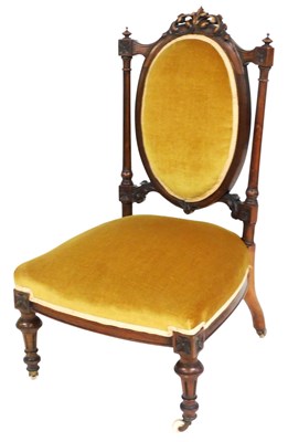Lot 785 - A Victorian walnut nursing chair, with a gold...