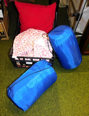 Lot 2131 - Two sleeping bags, together with a cushion,...