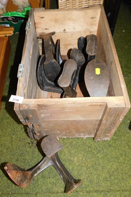 Lot 2158 - A group of cast iron shoe lasts, contained in...