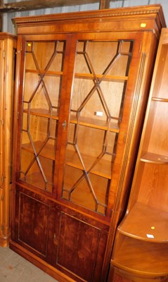 Lot 1134 - A Georgian style yew wood display cabinet,...