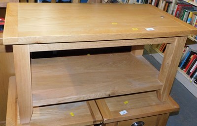 Lot 1003 - A contemporary light oak two tier coffee table,...