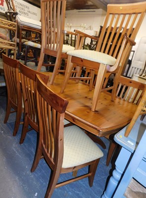 Lot 1060 - A pine extending dining table, 76cm high, the...